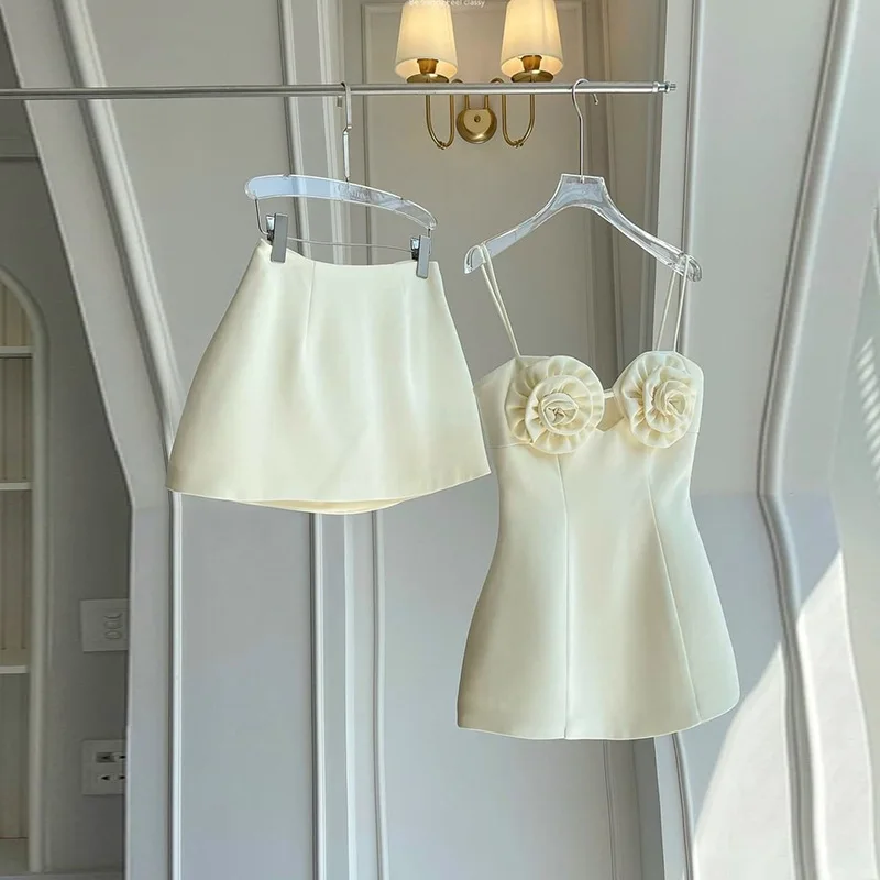 2024 Summer Fashion Design Sense Of Quality White Three Dimensional Flower Sling Top And Mini Skirt 2 Piece Set
