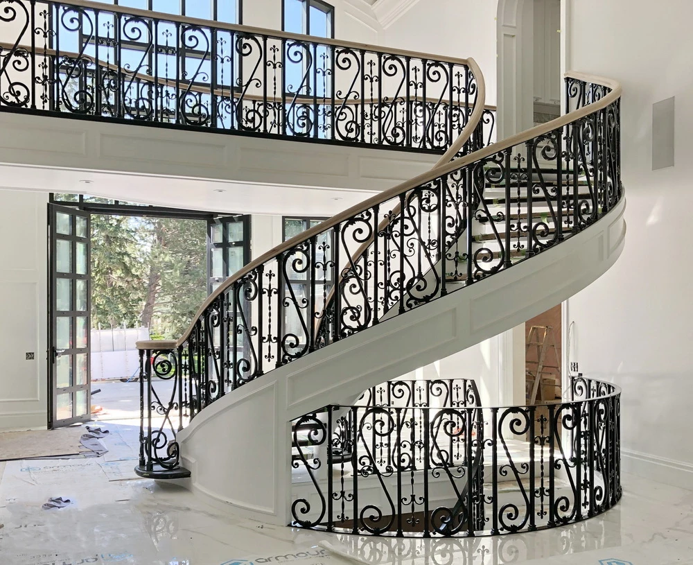 Luxury design curved stair marble/stone tread with wrought iron railing stairs from Foshan factory