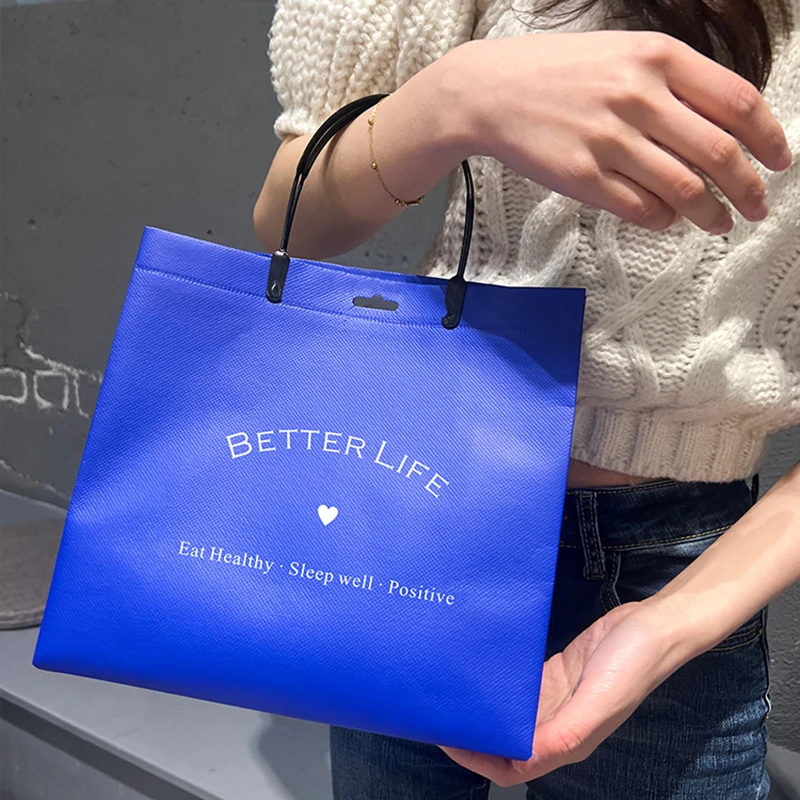 Wholesale environmentally-friendly degradable non-woven handbag free design LOGO gift shopping packaging clothes bag.