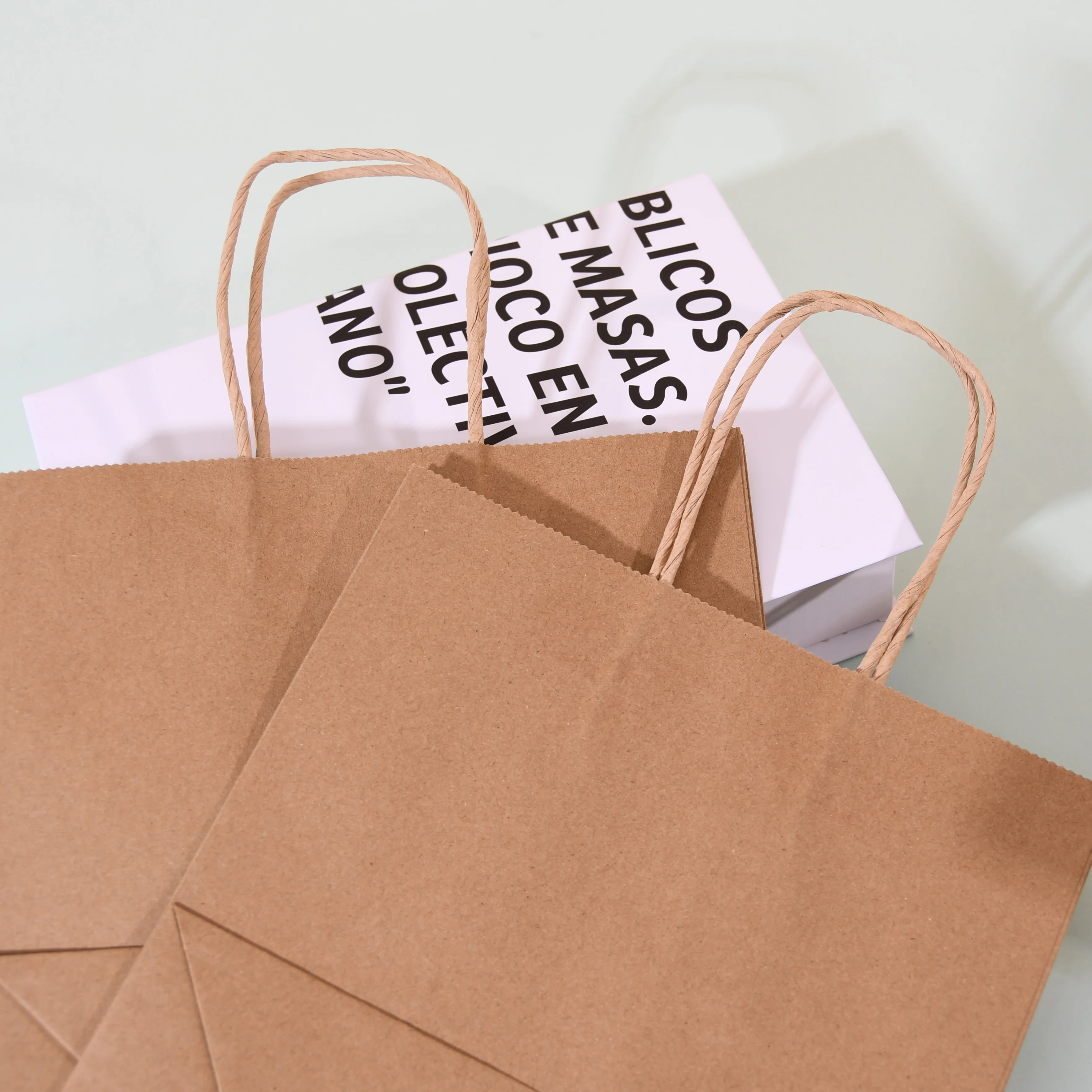 Eco-friendly Reinforced Handle Craft Paper Bags Custom Printed Logo Solid Durable Bottom Brown Kraft Paper Bag