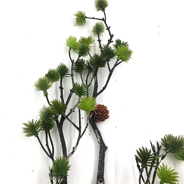 Green pine branches, pinecones, pine stems