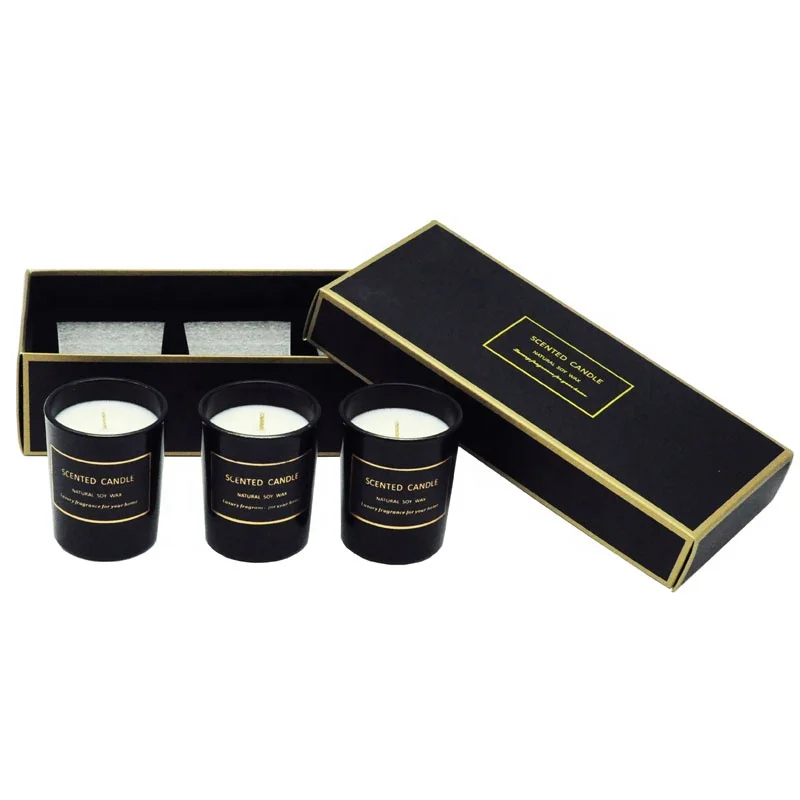 A three-piece black glass jar scented candle gift set