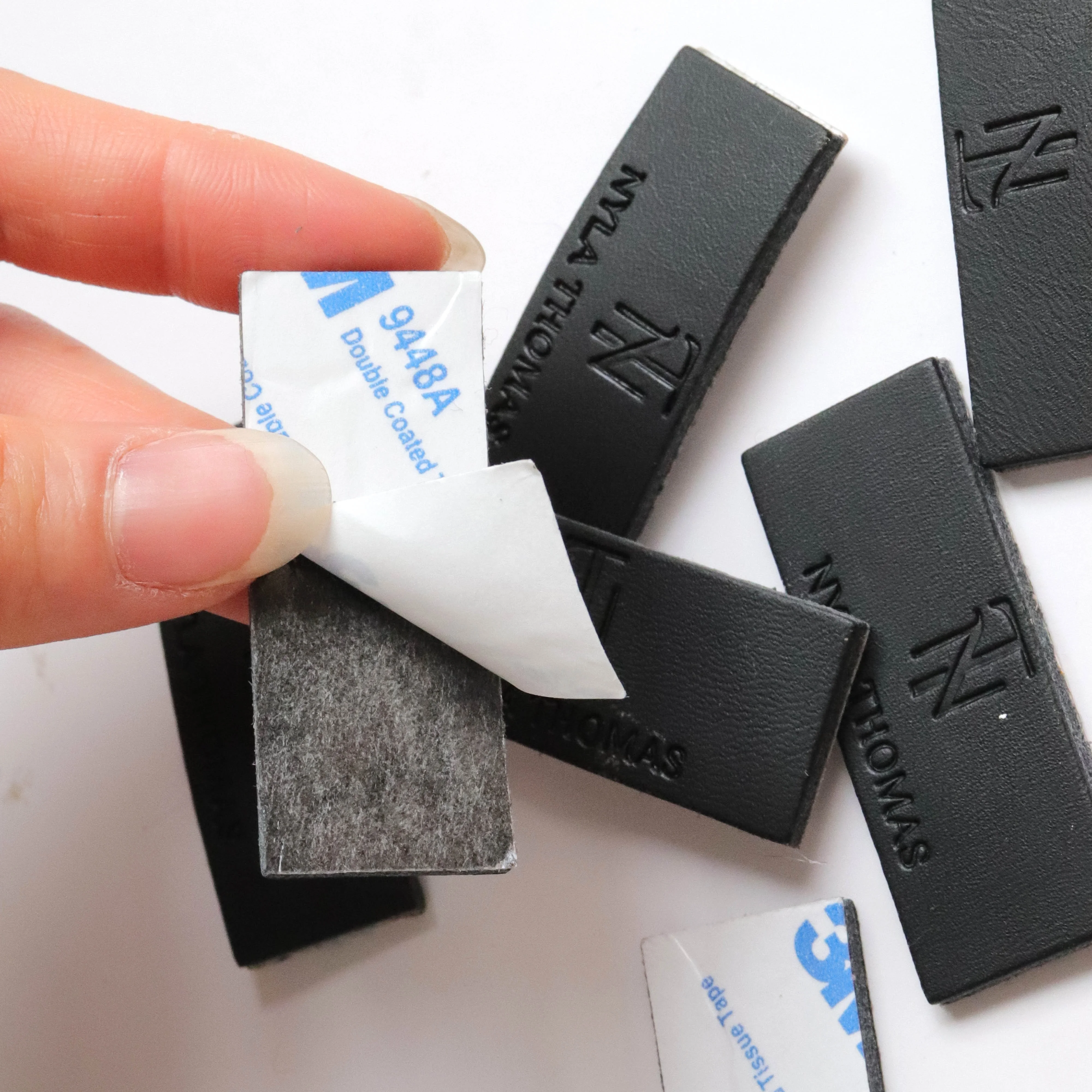 Wholesale High Quality Custom Black Genuine Leather label Tag Embossed Logo Jeans Patch bag Label PU Label Patch With 3M Sticker