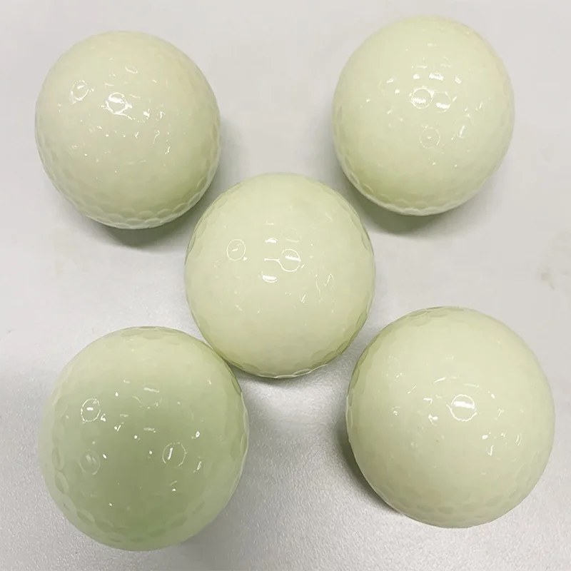 white fluorescent golf ball in golf  balls
