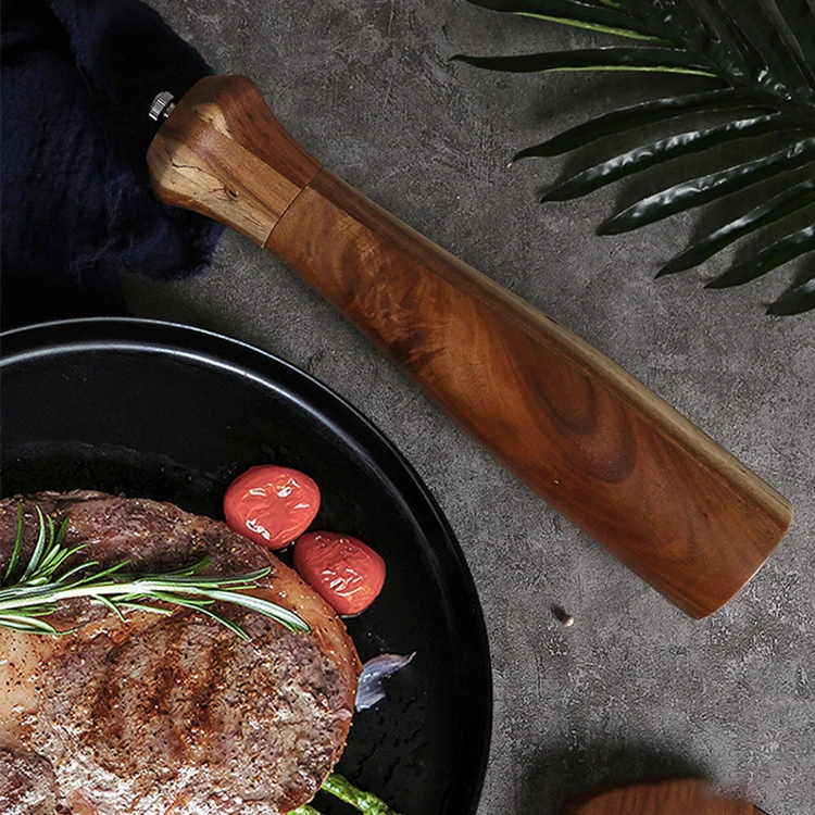 Pepper grinder made of acacia wood and constructed with ceramic core and stainless steel hardware, which makes it use easily