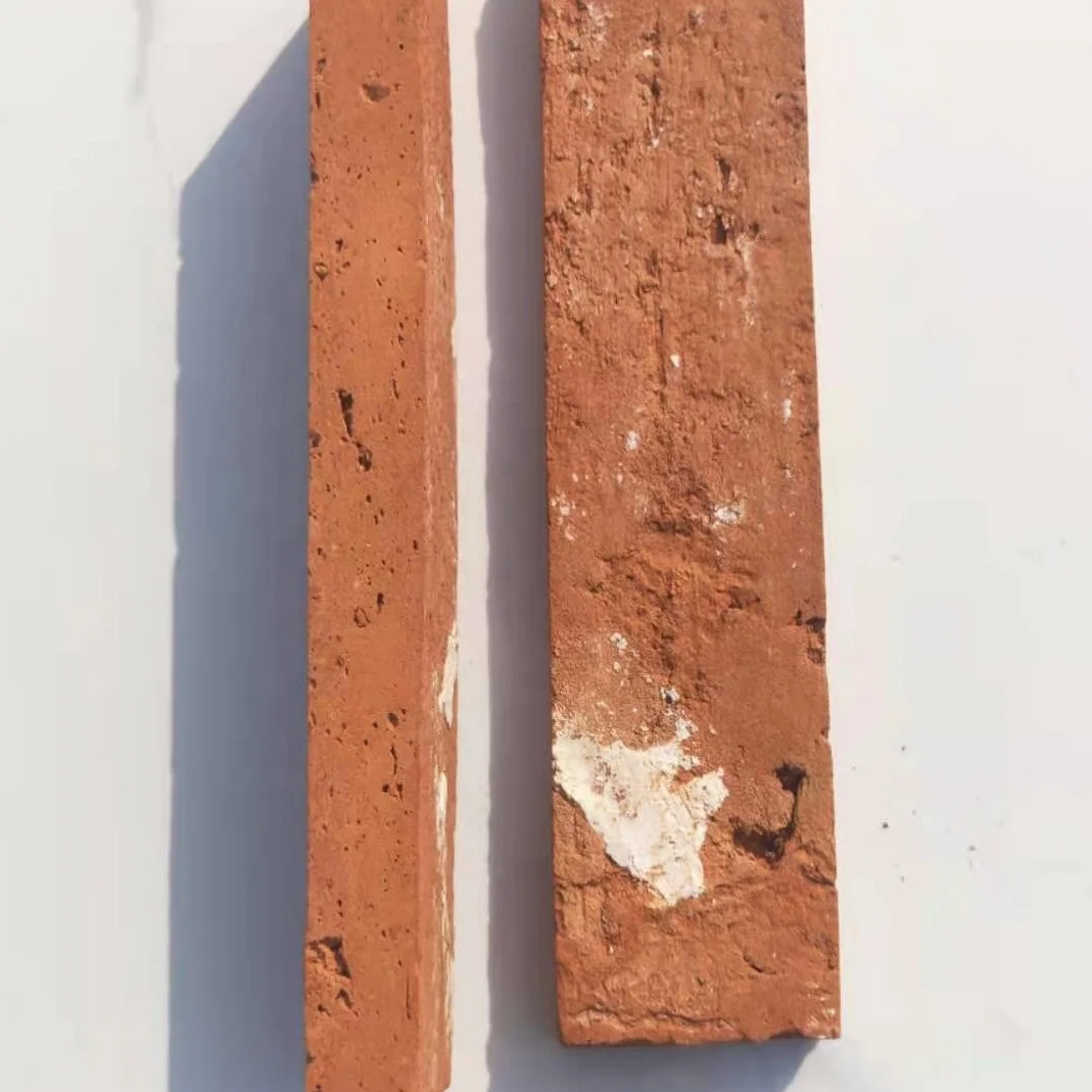 Korean style long strip of yellow clay bricks on the wall thin slices of old bricks