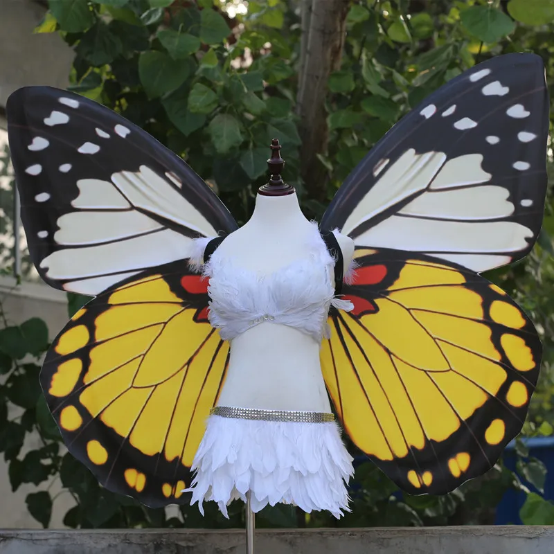 Adult models show large black wings fairy props to perform butterfly wings