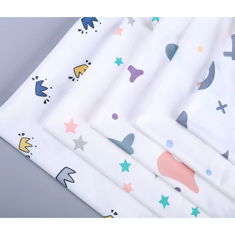 180 GSM Milk Silk Fabric Cartoon Style Crown Printing Factory Outlet Polyester Fabric For T-shirt/Pajama