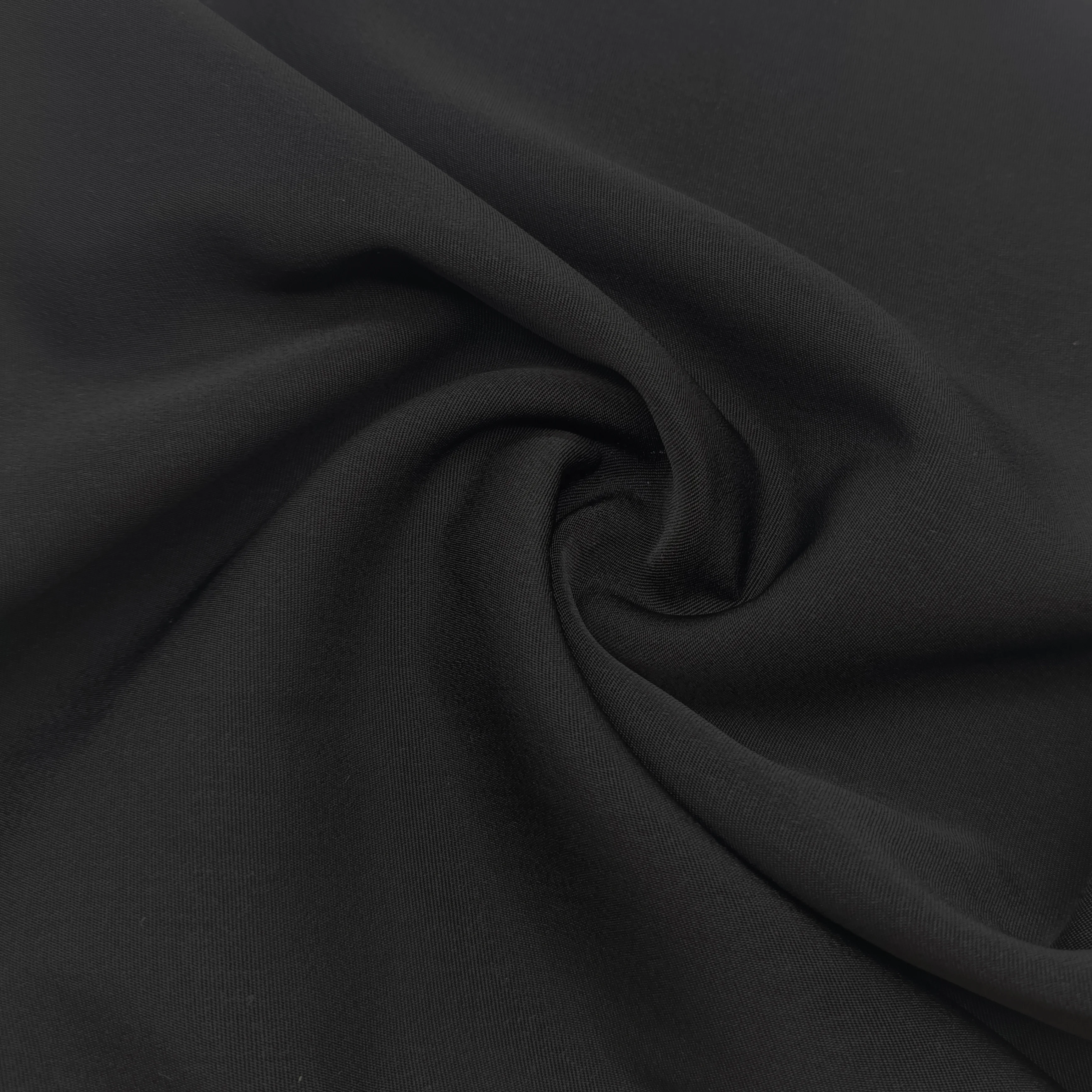 Cheap price 100% Polyester Peach Skin Black Fabric For Garment In Stock