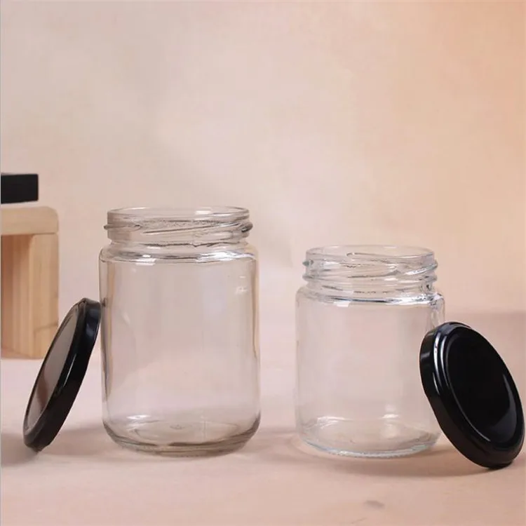 
250ml wholesale round glass bottles food glass jars with black tin metal lid for honey candy packaging 