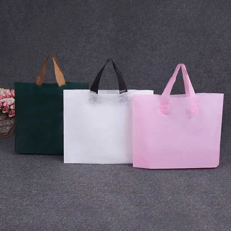 
Custom Printed Logo Design Tote Punching Carry Handle Fashion Gift Plastic Bag Clothing Packaging bags with handle 