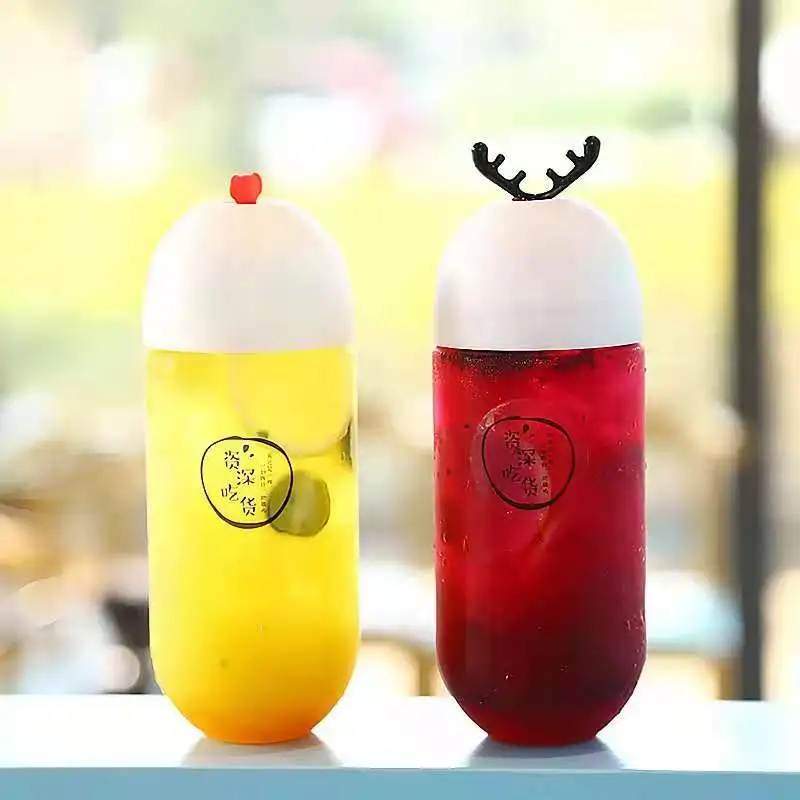 Hot Selling Capsule Shape Beverage Bottle Personalized Antler Stopper Transparent Plastic Bottle Creative Juice Bottle