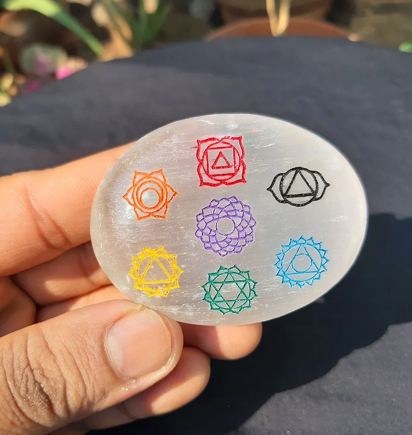 
Selenite Engraved Palm Stone With Chakra Symbol, Selenite Polished Crystal Tumbled Palm Stone - Selenite Stone For Sale 