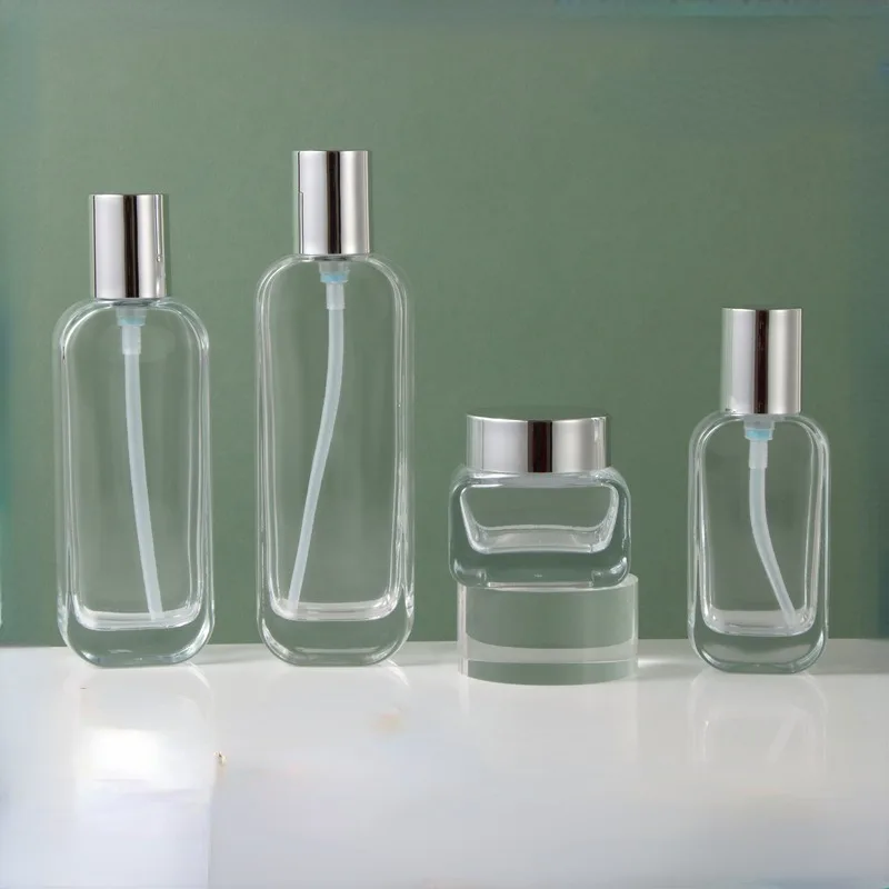 Wholesale cosmetic packaging container frosted skincare set bottle glass face cream jar with bamboo lid