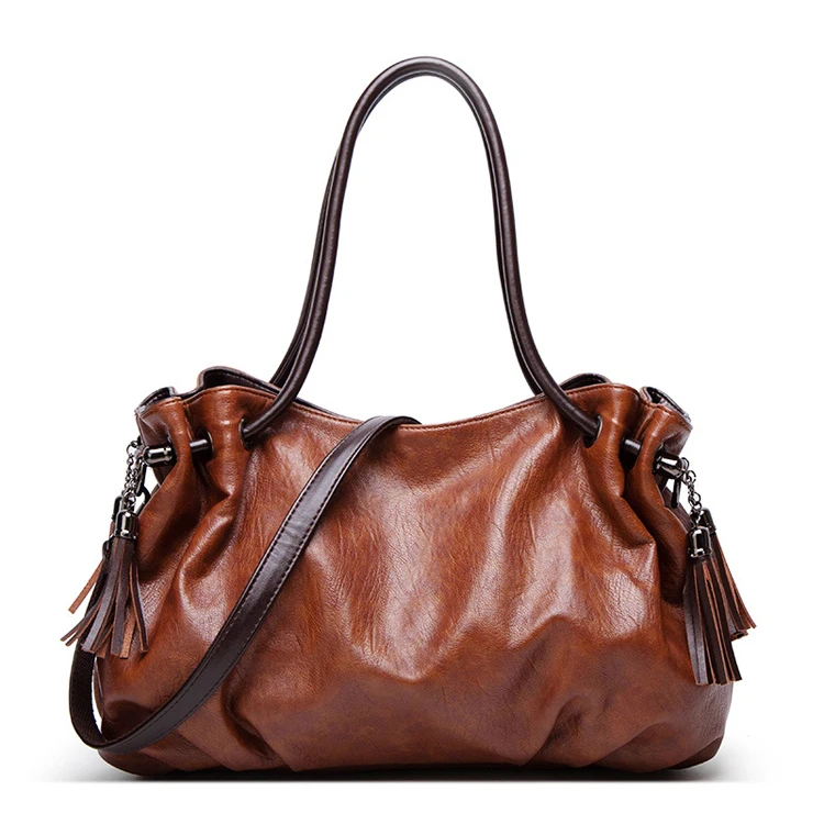 Trendy designer guangzhou retro ladies purses and handbags elegant Black women soft leather cheap handbag bags with tassel
