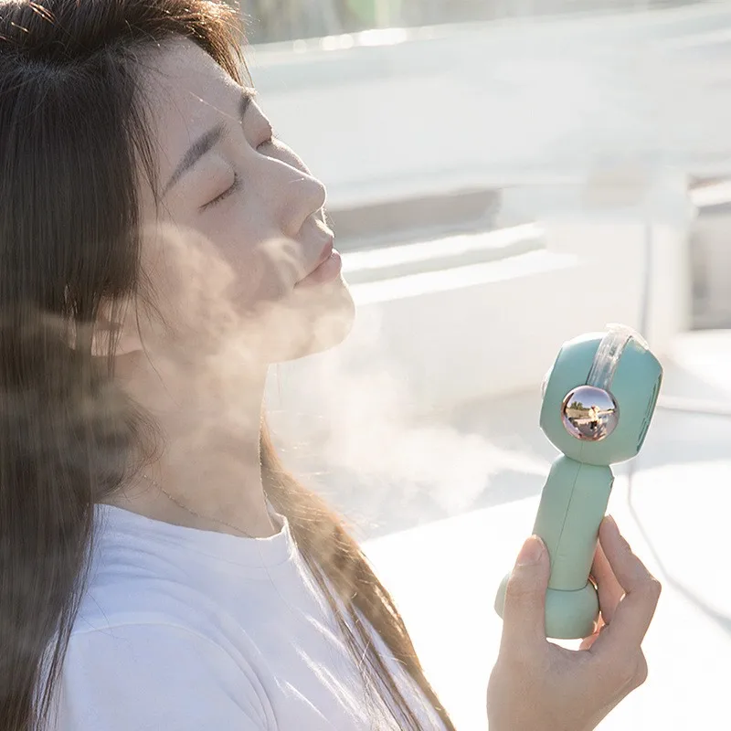 New handheld fan spray cooling fan portable mini student cartoon cute electric fan USB