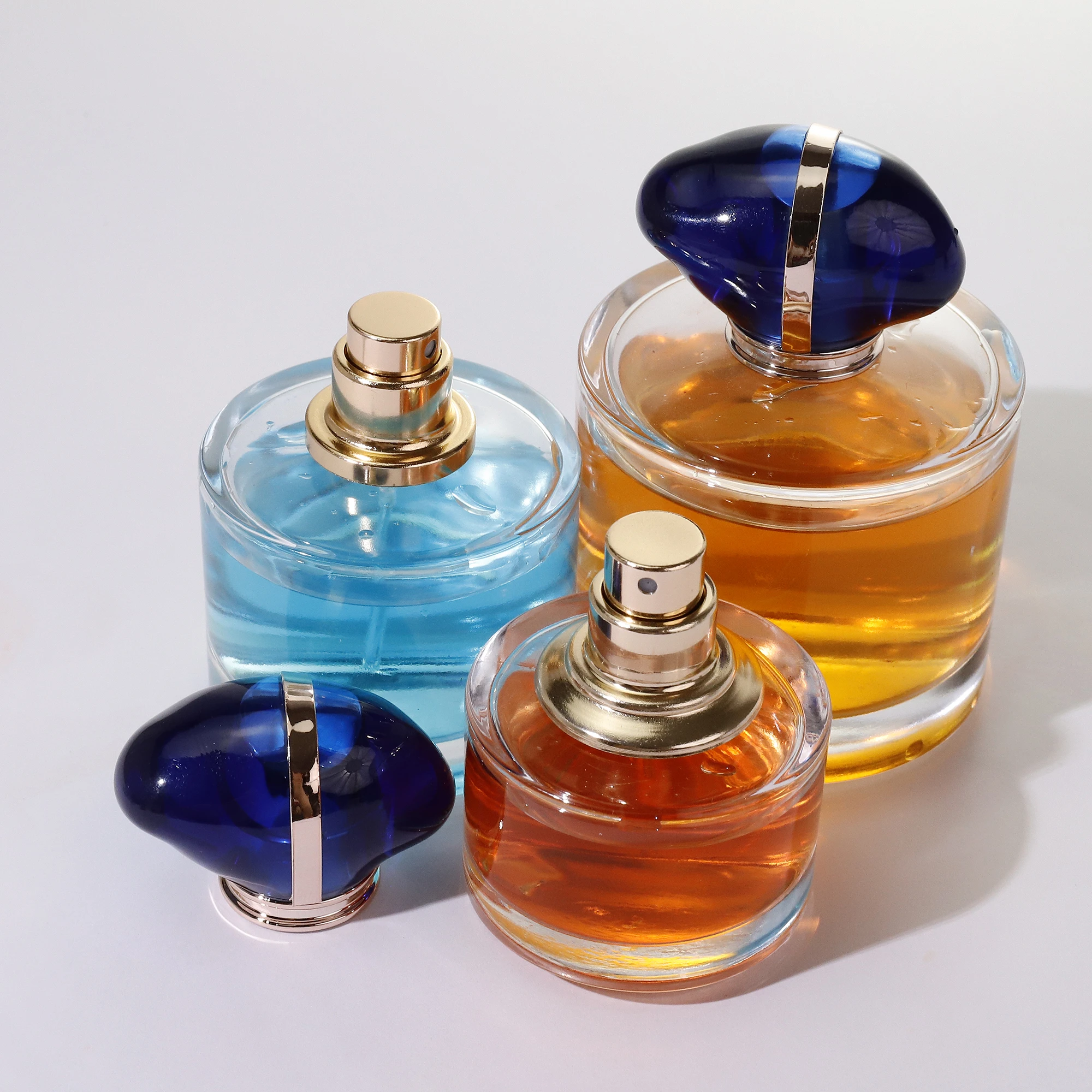 Luxury High Quality Portable 50Ml 100Ml Refillable Round Empty Cap Glass Perfume Bottles with Cap