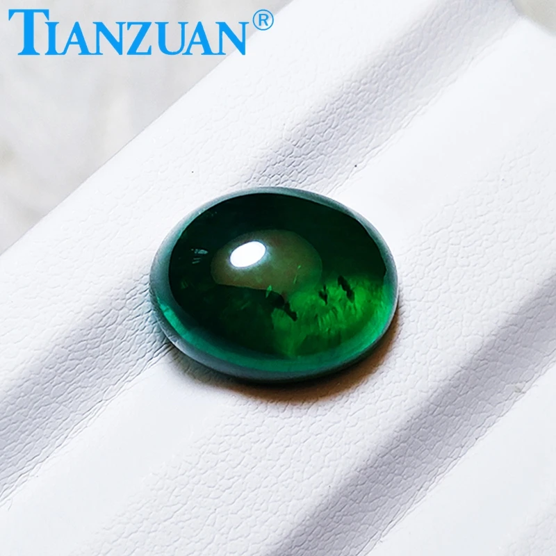 Oval shape flat back cabochon Hydrothermal emerald green color including minor cracks inclusions loose gem stone