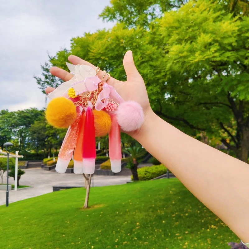 
Custom lip Gloss private label candy flavor hose tube lip gloss plush ball lace waterproof moisturizing emollient lip glaze 