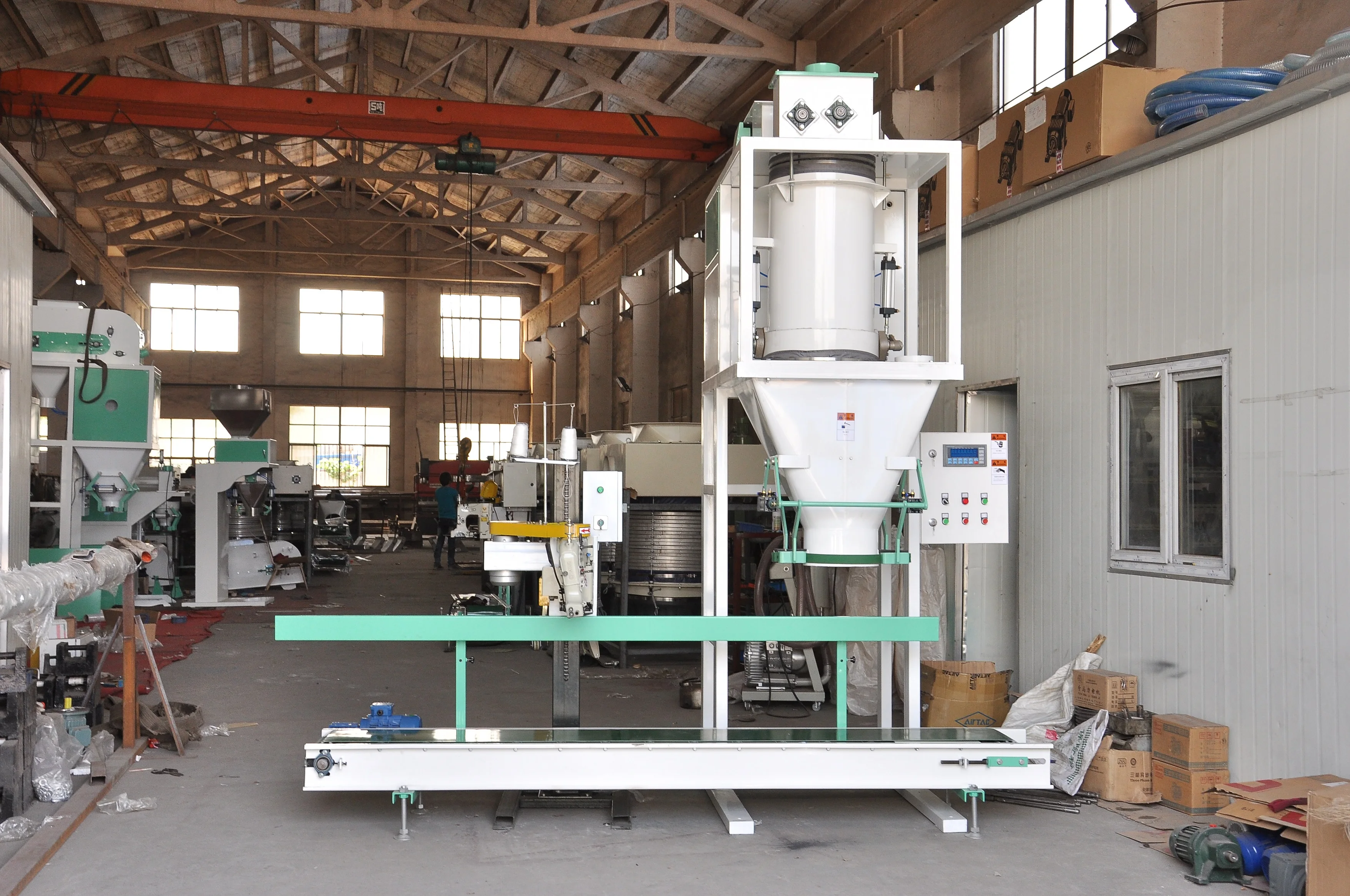 Bag infeed system Tag dispenser Sewing line with synchronized bag top chain conveyor premade tag application device