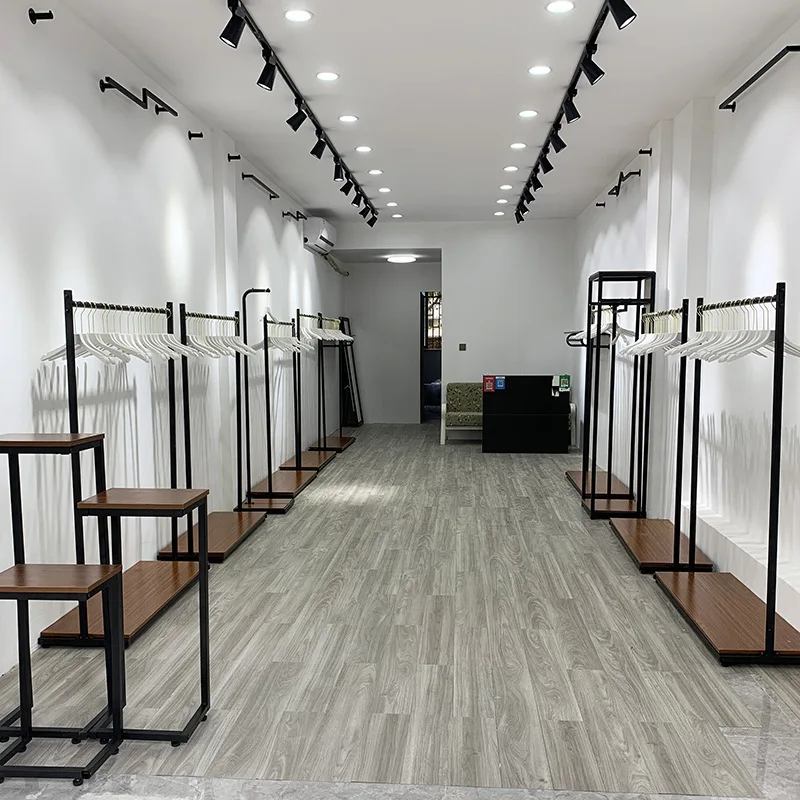 Kainice Customized Freestanding Industrial Pipe Metal Garment Display Stand Clothes Rack for Clothing Store