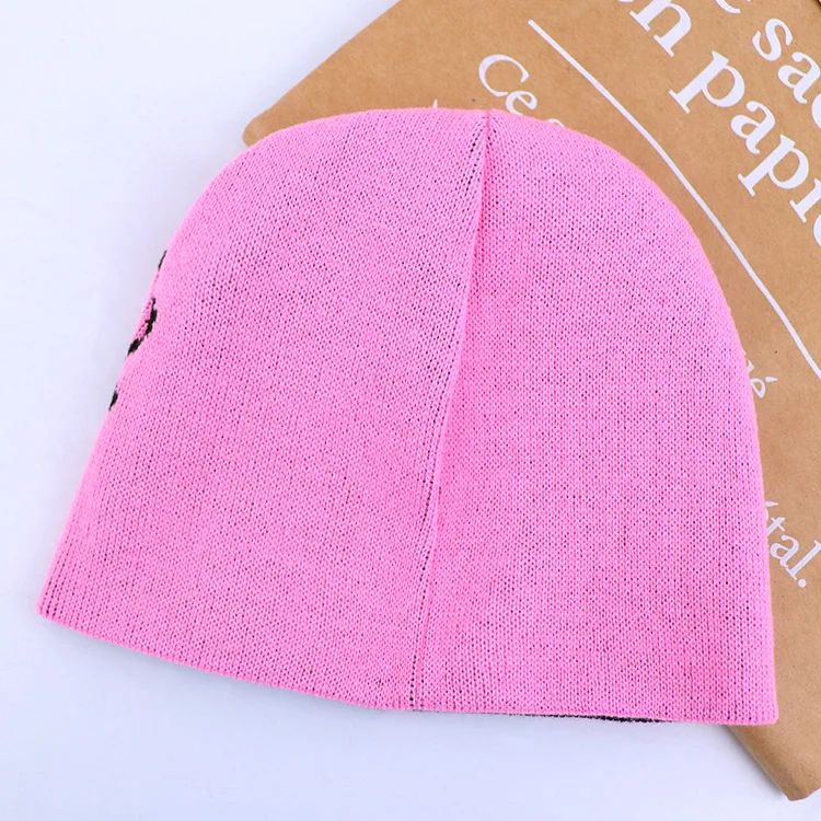 Qianzun manufacturers pink letter logo cuffless acrylic custom jacquard knit reversible beanie hat