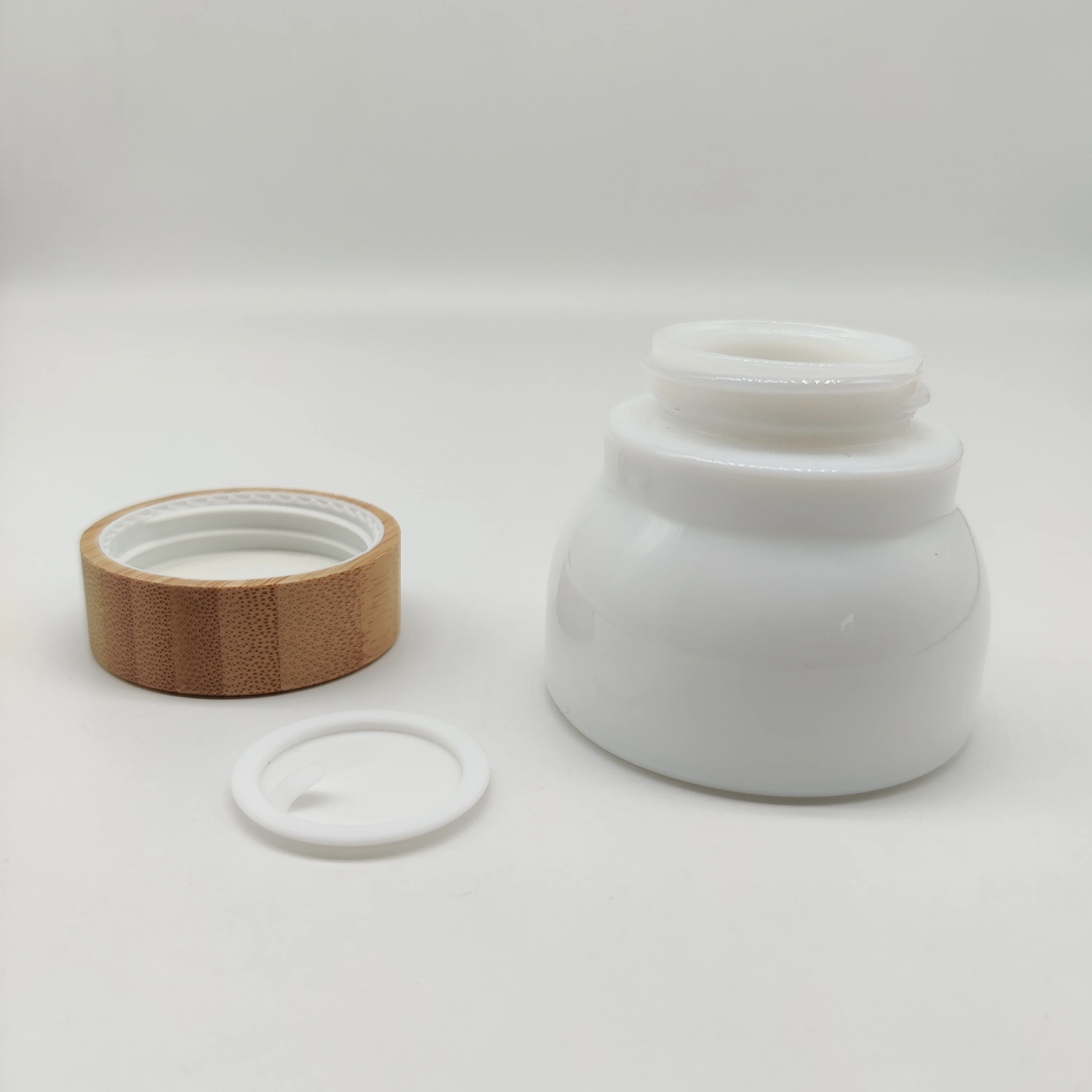 Factory Hot Sell Cosmetic Packaging Glass Bottle with Bamboo Lid 50ml 150ml Opal White Screen Printing Dropper White ,black