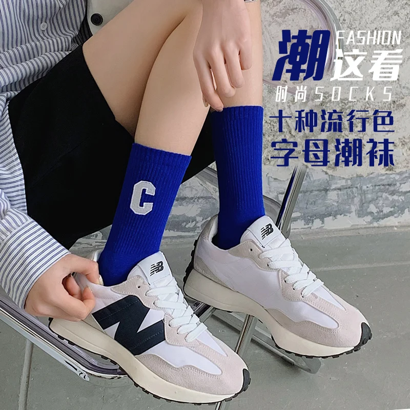 Manufacturer hot sale fashion trend letter Klein blue socks mid-calf length cotton teens socks