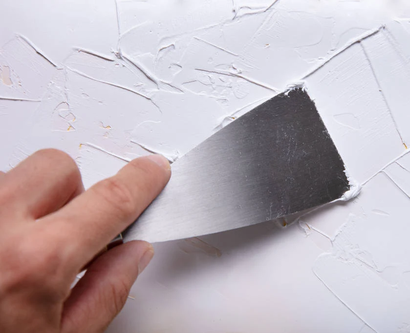 Yellow plastic handle stiff blade putty knife scraper for building renovation