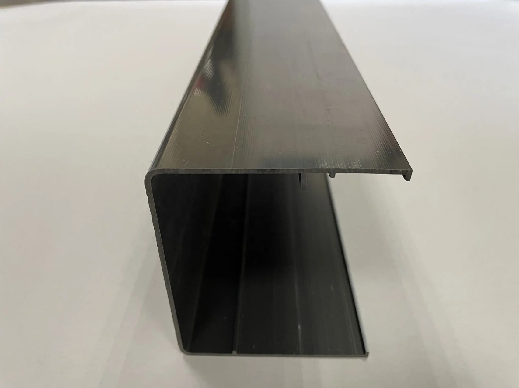 Plastic U shaped extrusion decorated profile for edge trimming