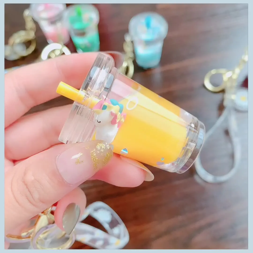 CustomMoving Liquid Quicksand Cute Keychain Charms Milk tea  Daisy Floating Keyring for Women Charm Bag Pendant Kids Gift