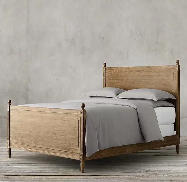 Custom furnished French style bedroom with large solid wood bed