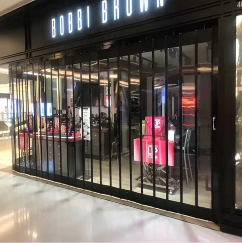 High-end shopping mall brand store sliding door transparent anti-theft beautiful solid aluminum alloy pvc crystal folding door
