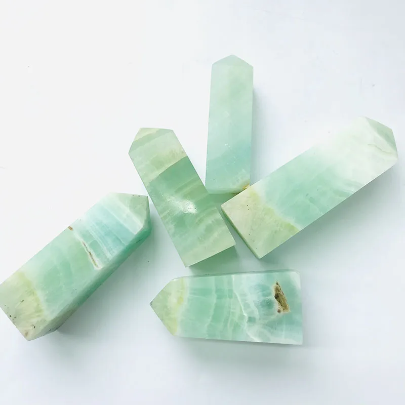 Wholesale high quality natural crystal points hand carved caribbean calcite four face towers for decoration