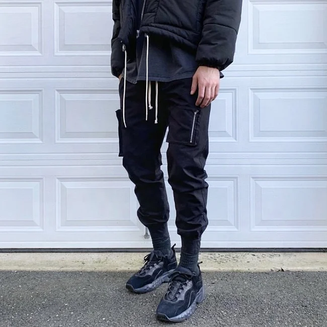 
Low moq street multi zipper pockets pencil pants solid color elastic drawstring jogger pants popular casual cargo pants stock 