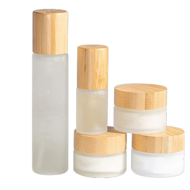 Factory wholesale cosmetic facial toner bottle set with bamboo cover frosted glass emulsion bottle
