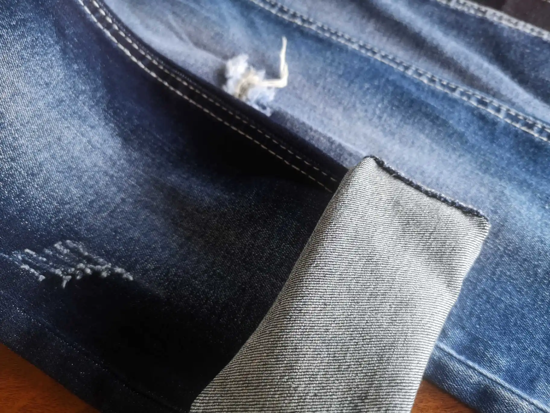 2549 Soft OE Foshan denim manufacturer raw material bull woven twill high stretch denim fabric for shiny jeans