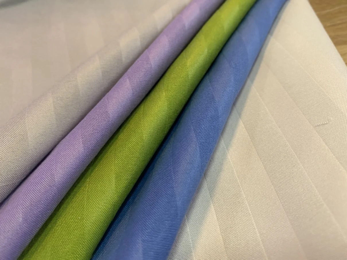 Wholesale 100% polyester stretch knit Dyed Embossed cheap embossed printed fabric for garments