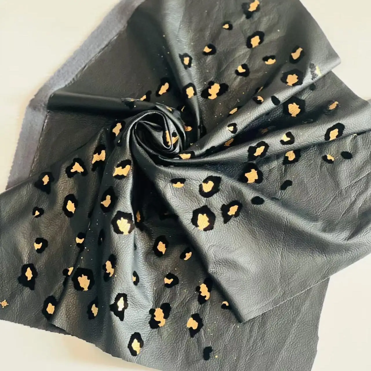 Faux leather flocked leopard print