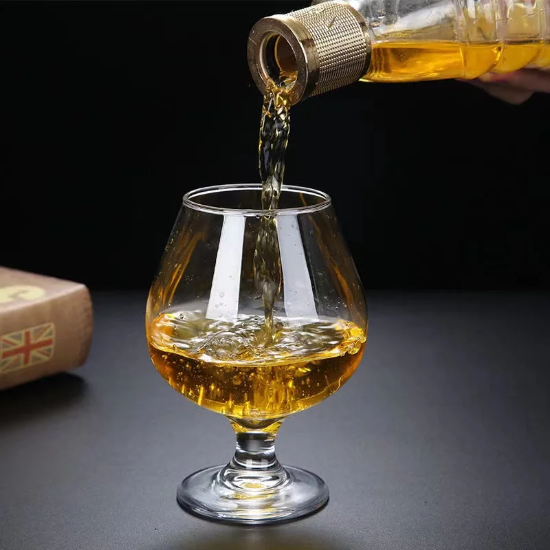 A brandy glass a cognac glass a whisky glass