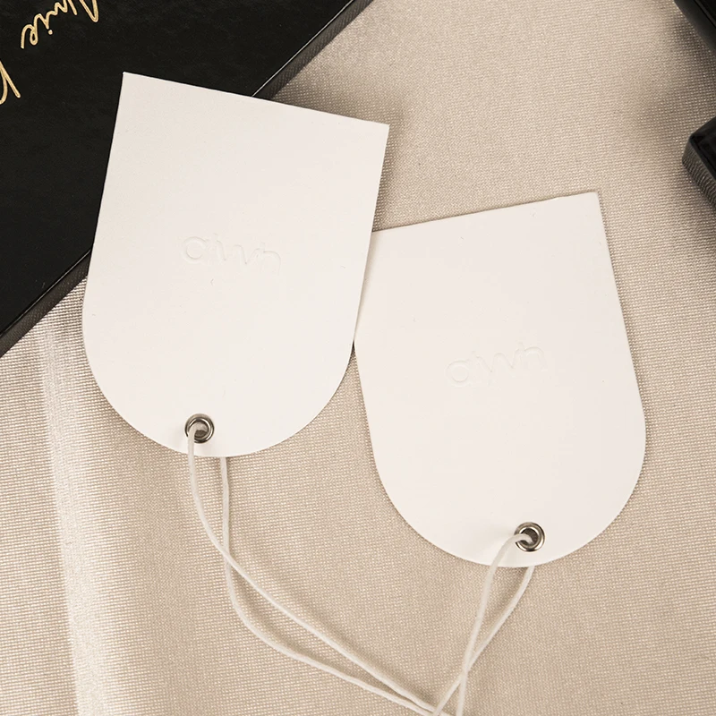 custom embossed logo metal eyelet hangtag paper swing tag arch shape tag with string