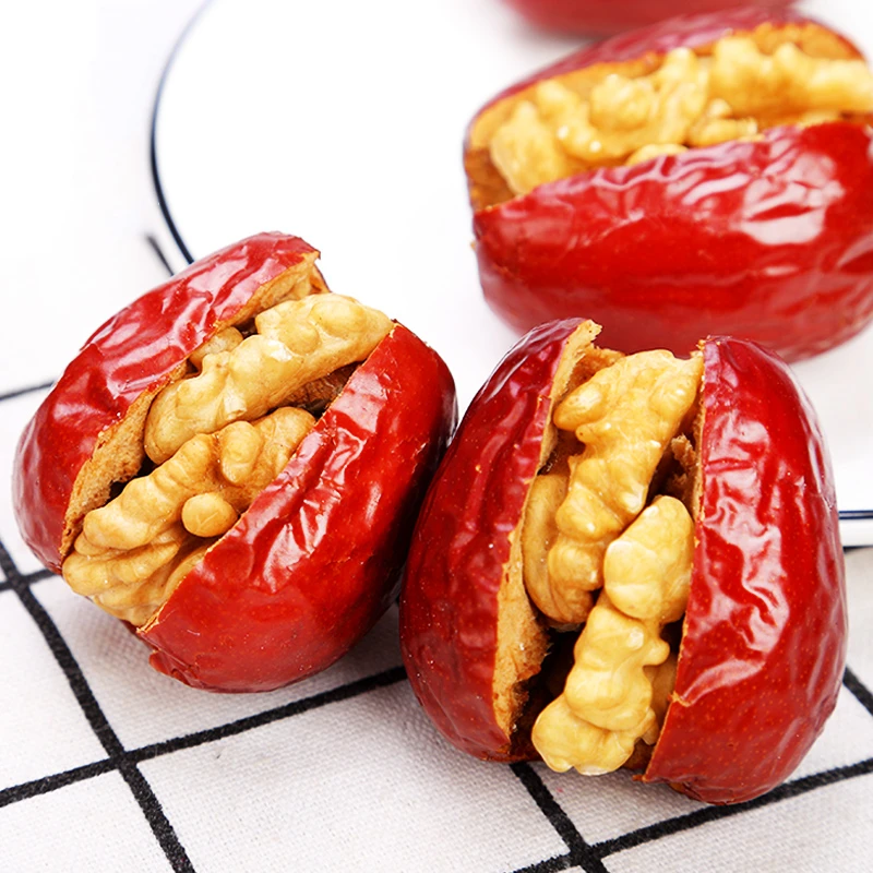 Handmade walnut kernels and red dates for producing nut snacks