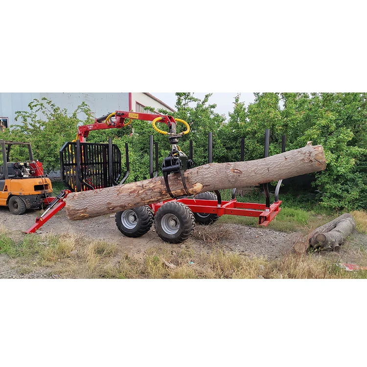 log trailer with grapple mounted farm tractor