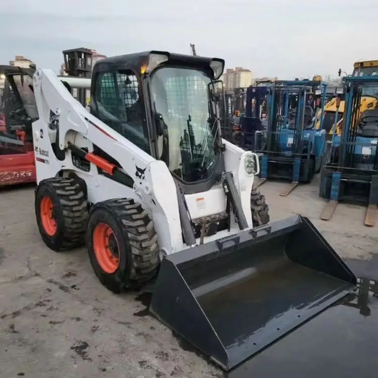 Подержанный высокомощный скользящий погрузчик Bobcat S750 с грузоподъемностью 1 4 тонн продается дешево а S70