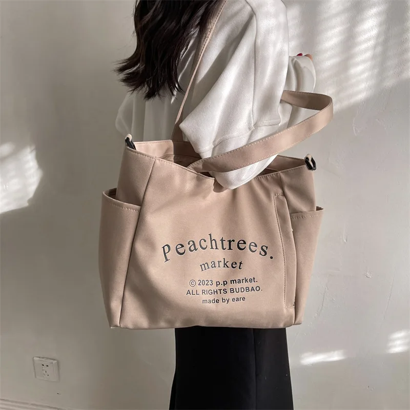 Student class canvas bag Female 2023 new fashion letter Tote commuter large capacity single shoulder crossbody bag