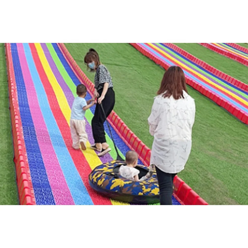 Commercial Rainbow Slide Artificial Ski Grass Turf Surface Donut Slide Ride Dry Slide Slope For Adult