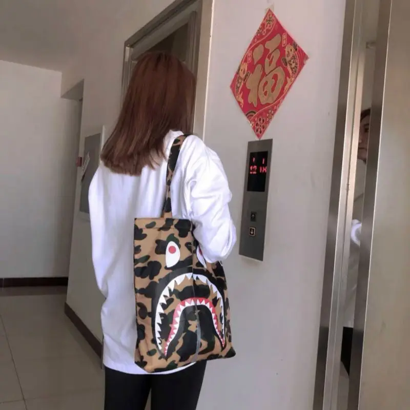 INS Hot BAPE Bags Camouflage Shark Red Eyes Black Teeth Print Simulated Zipper Tote Bags Trendy Shoulder Couple Bags