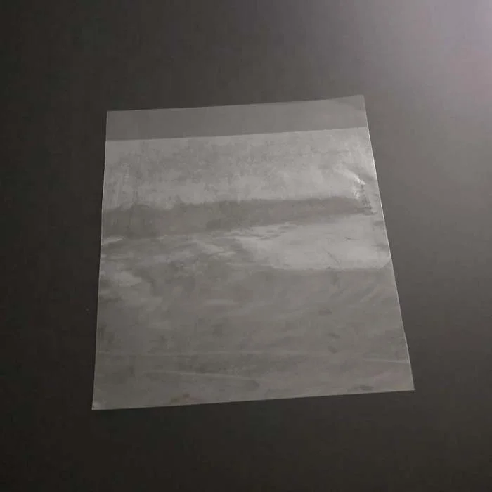 In Uae Coating Glue On The Film Handle Tripack Bopp Films For Making Bags