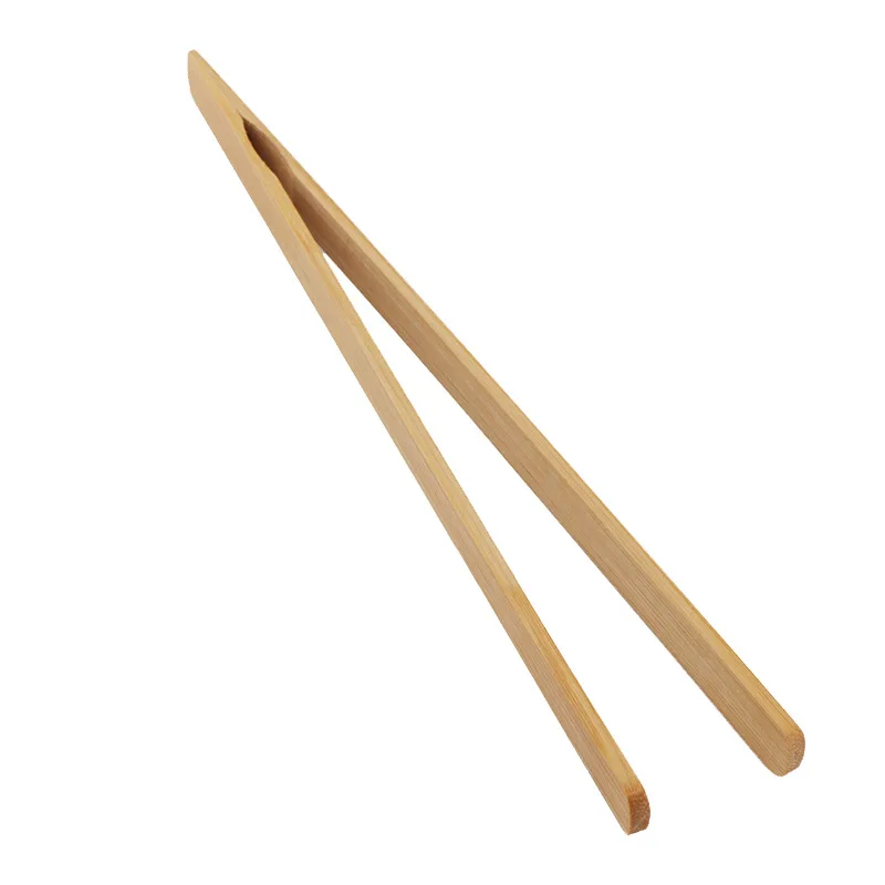 straight Tea with ebony chicken wings Wooden teacup with tea pliers Bamboo and wood tea tools