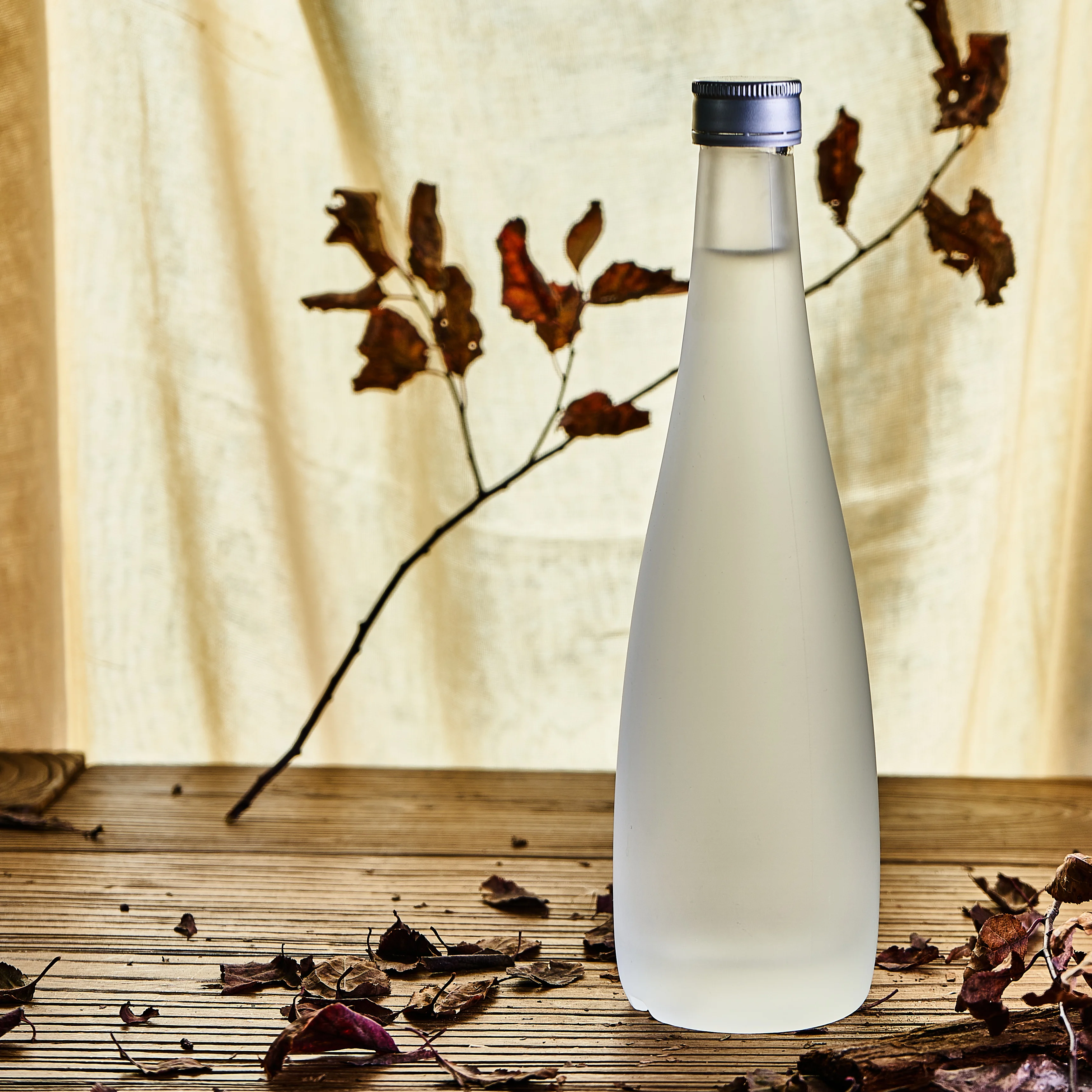 Custom Design 500ml 750ml Frosted Clear Round Shape High White Glass Material Liquor Wine Bottle With Wooden Cork